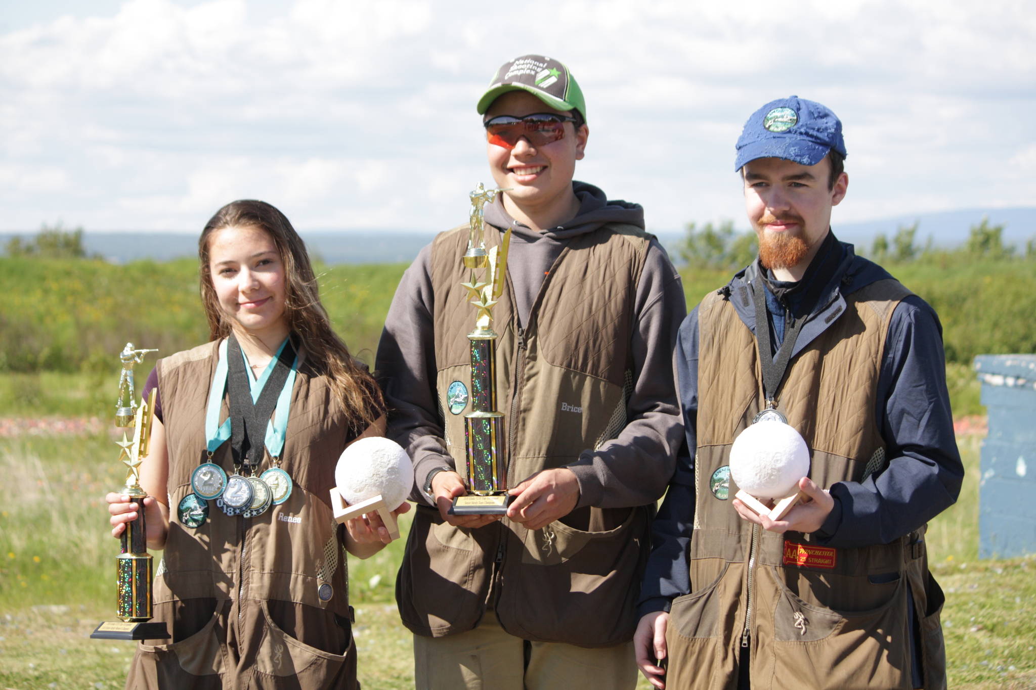 Renne Winn, Brice Norton, Garret Hermann pose with their trophies after placing first as a team in the HAA Trap Triumphant Competition at Birchwood Recreation and Shooting Park in Chugiak. (Courtesy Photo | Mark Kappler)