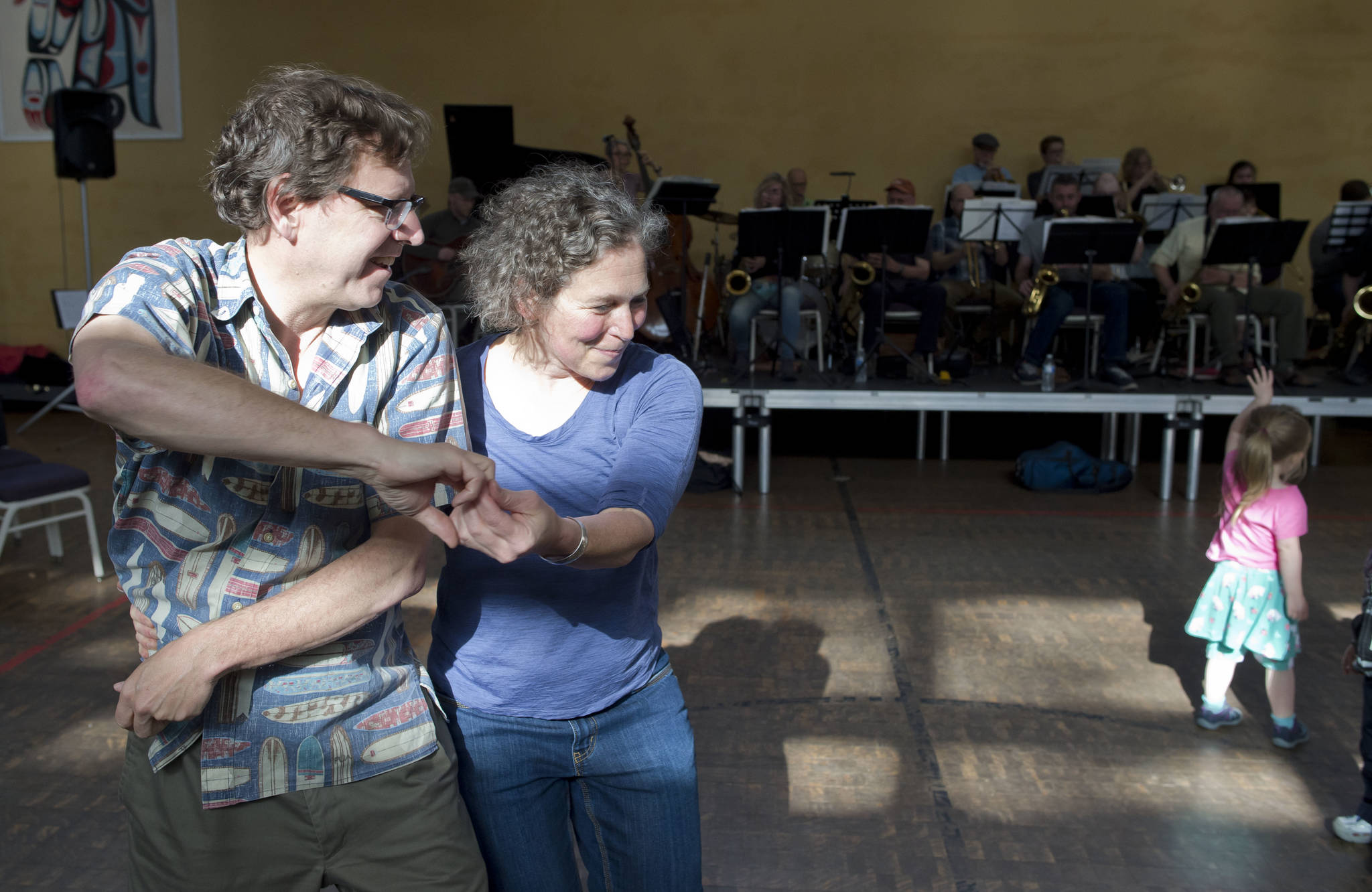 Dr. Alex Malter dances with Dr. Marna Schwartz to the music of the Thunder Mountain Big Band during the Block Party at the Juneau Arts & Culture Center on Friday, June 15, 2018. (Michael Penn | Juneau Empire)