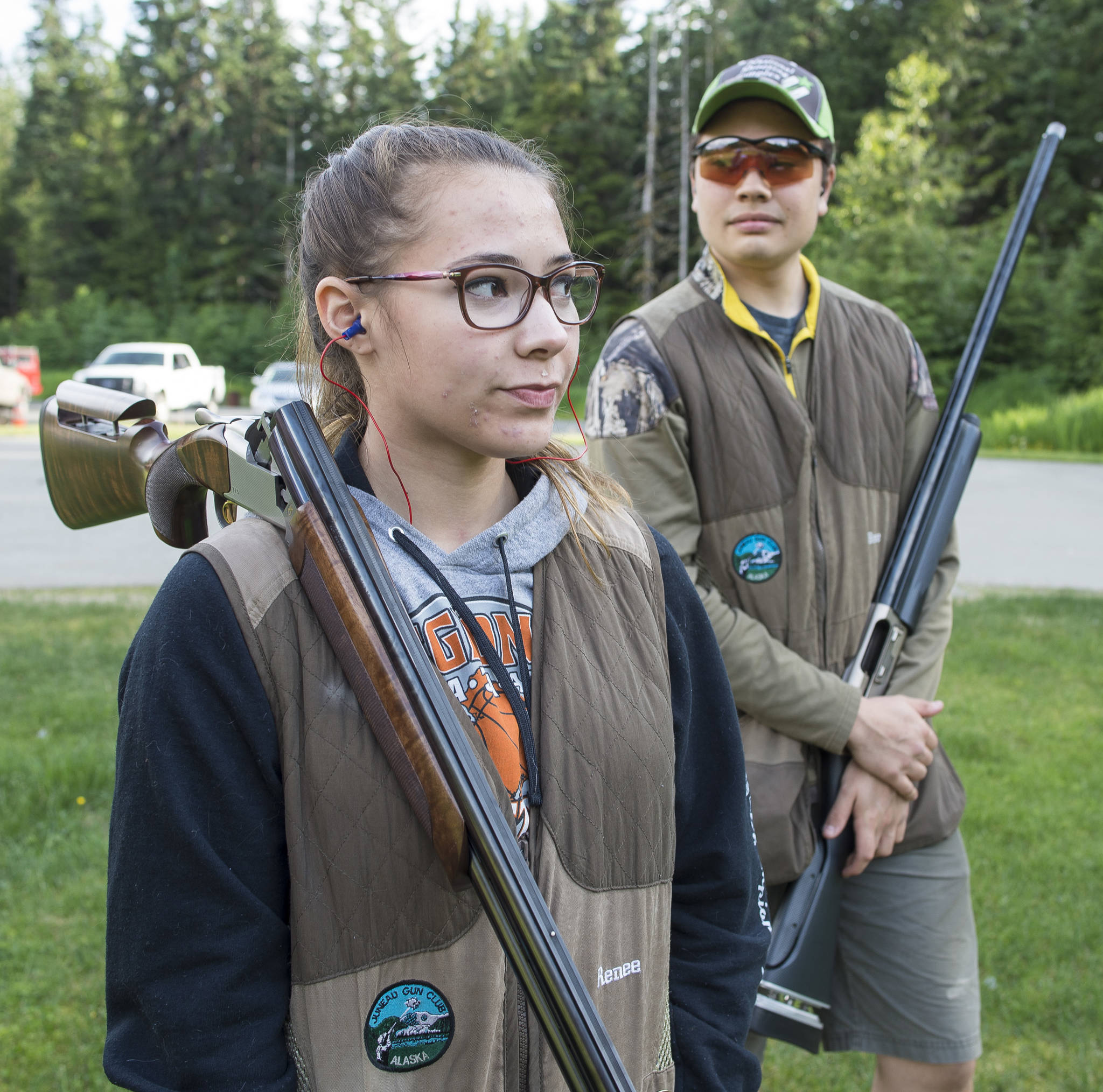 Renee Win and Brice Norton wait their turn during their trap shooting practice at the Juneau Gun Club on Thursday. (Michael Penn | Juneau Empire)