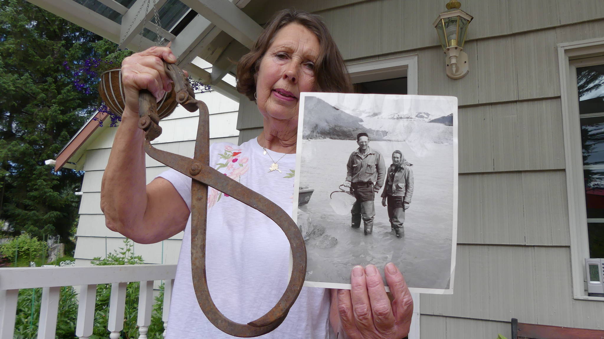 Juneauite Linda Mead Wahto holds up the very tongs her parents used to haul icebergs out of Mendenhall Lake. Ray Friedlander | For the Capital City Weekly