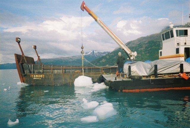 Alaska Glacial Ice harvests floating icebergs with the use of the eighty foot long landing craft Itswoot along with a forty foot long barge. Photo courtesy of Scott Lindquist.