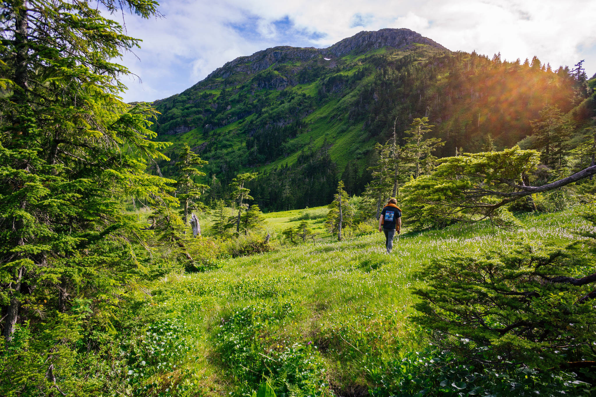 Zach Gianotti walks around the west side of Cropley Lake on Sunday, June 24, 2018. (Gabe Donohoe | For the Juneau Empire)