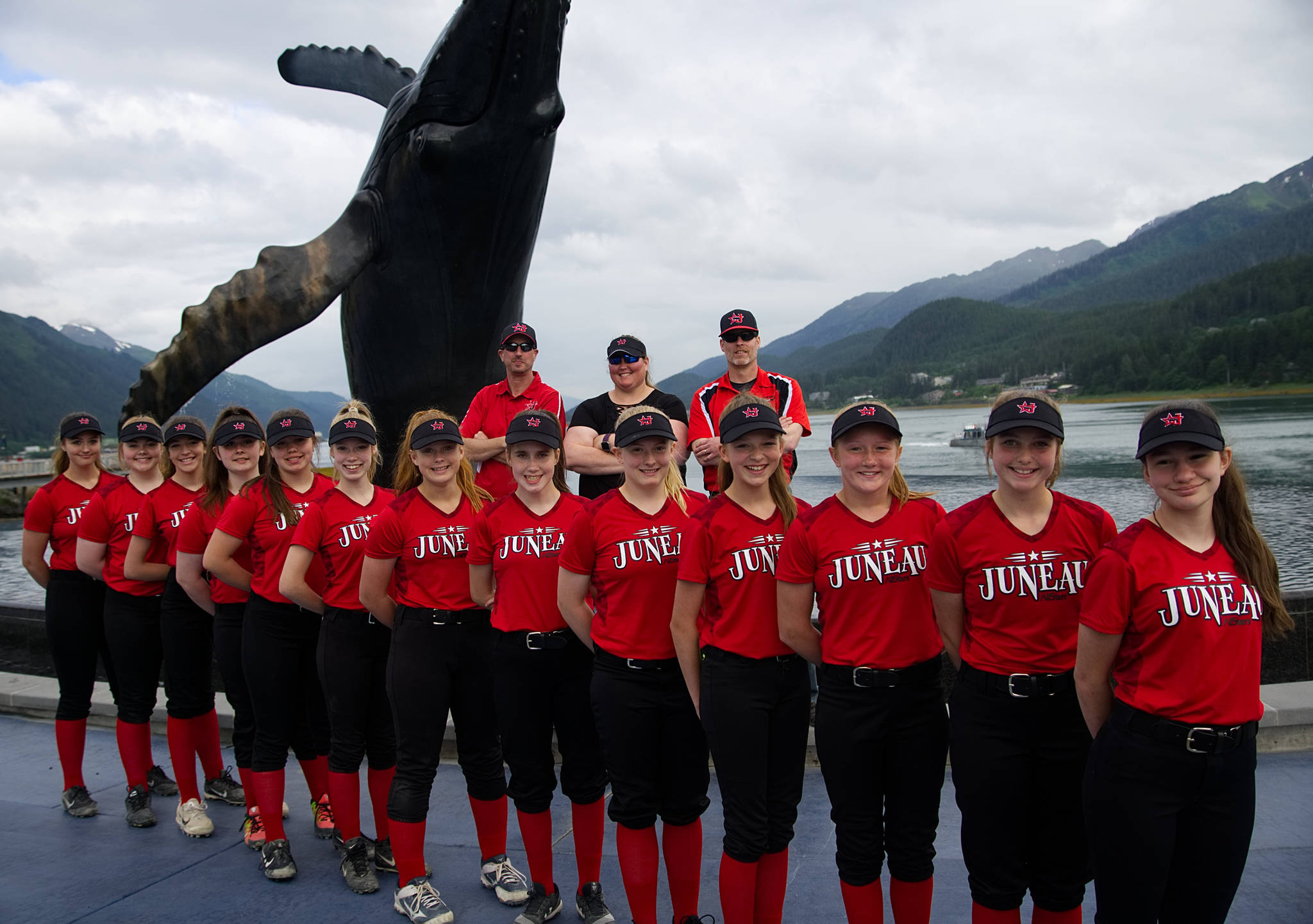 The Gastineau Channel Little League Junior Softball all-star team poses in front of the whale statue downtown. (Courtesy Photo | Lexie Razor)