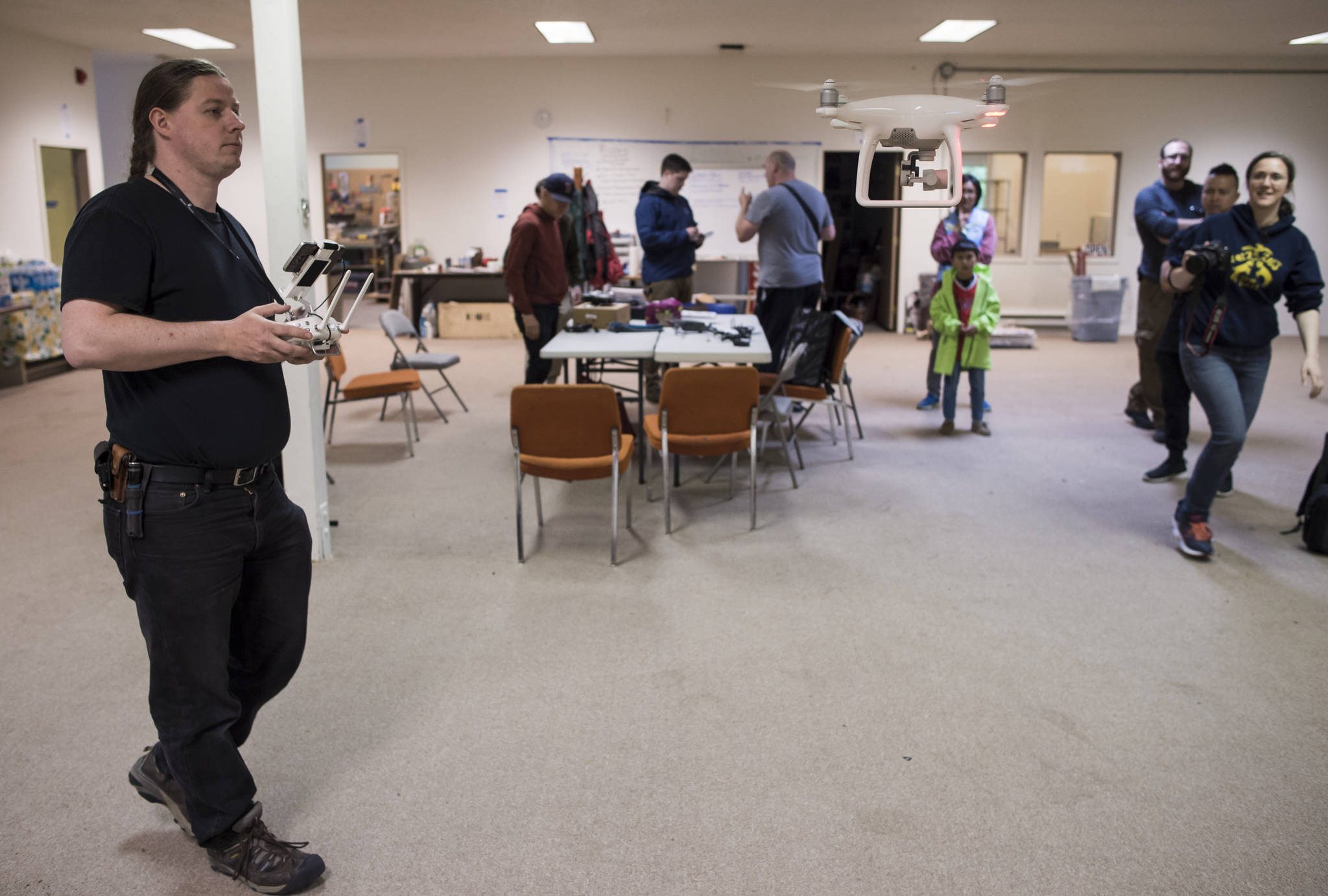 Mikko Wilson demonstrates his DJI Phantom 4 drone during a meetup at the Makers Space in Douglas on Thursday, June 28, 2018. (Michael Penn | Juneau Empire)