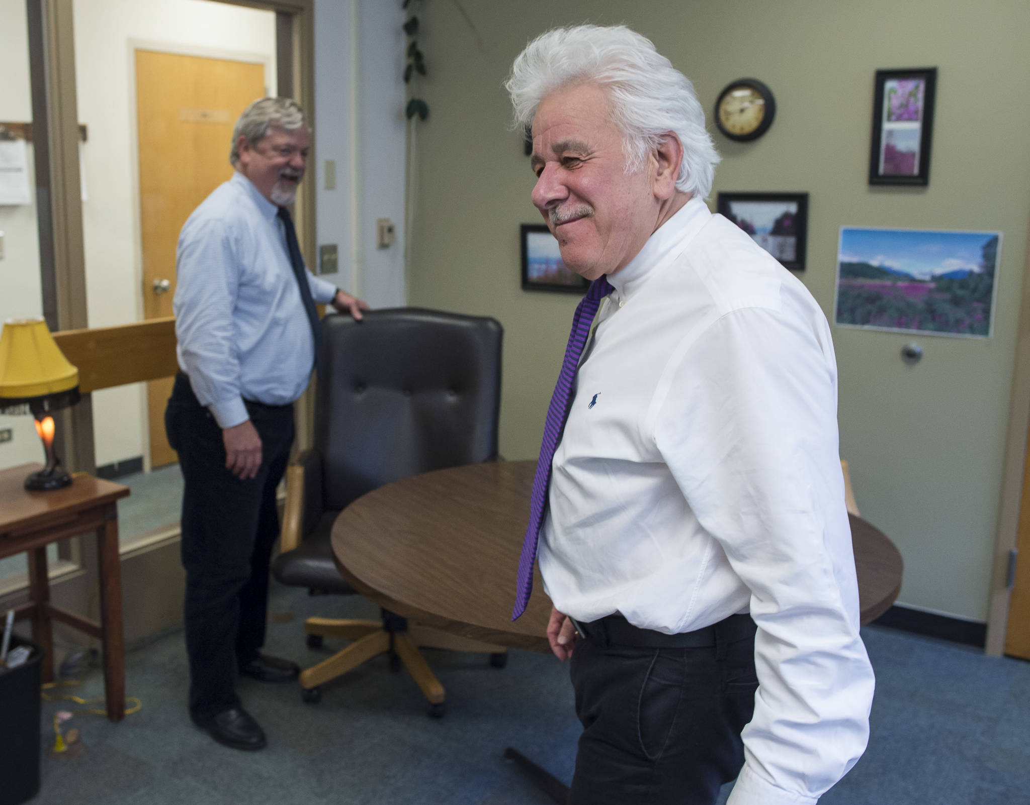 Juneau District Court Judge Thomas Nave, left, and Juneau Superior Court Judge Louis Menendez talk with each other outside their individual offices at the Dimond Courthouse on Friday, June 29, 2018. Both judges are retiring and Friday was their last day at work.