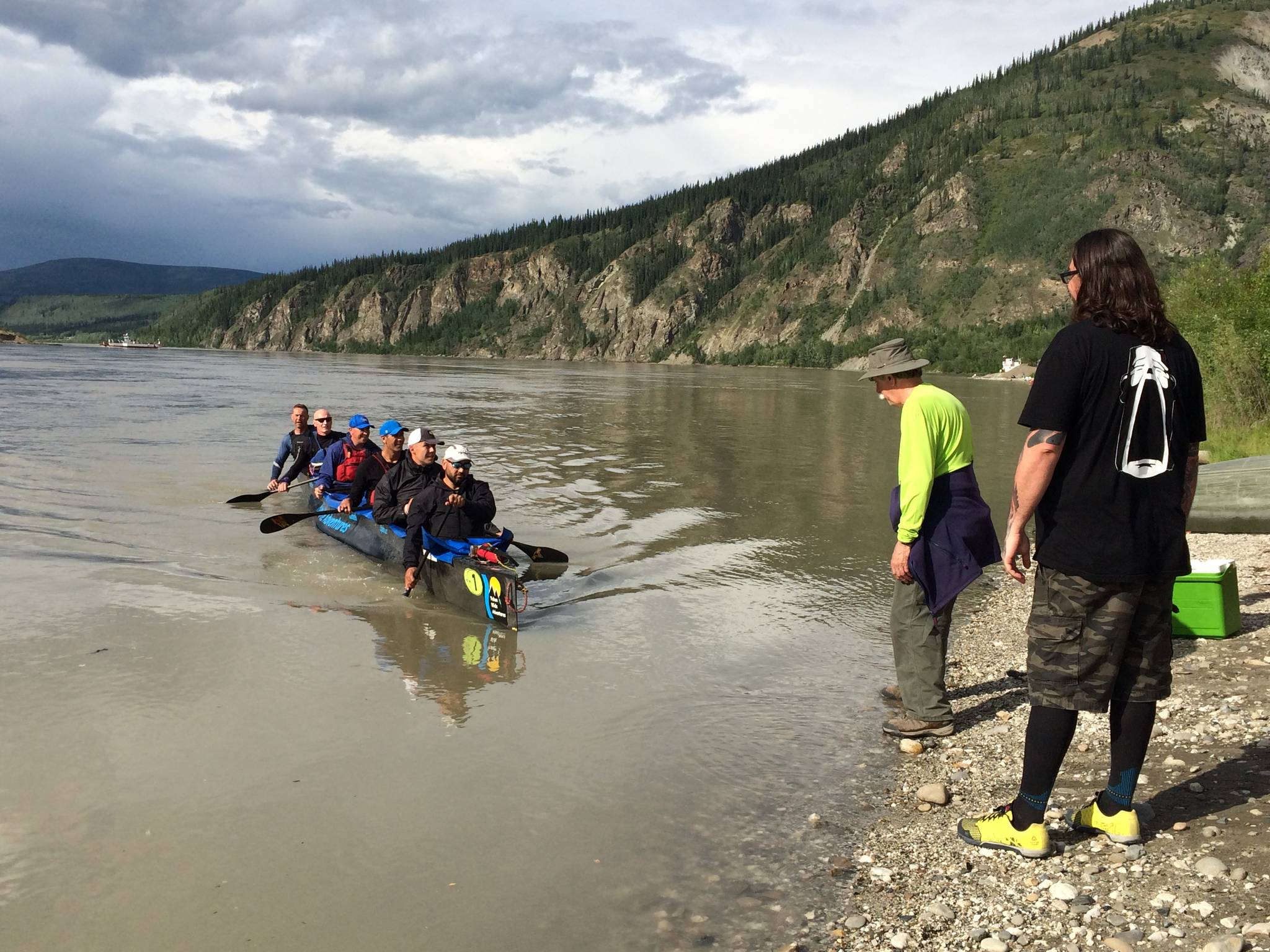 Yukon Wide Adventures pulls their voyageur canoe ashore on Friday evening in Dawson City, Yukon. The team finished the race first overall and first in the voyageur canoe category. (Courtesy Photo | Eva Holland)