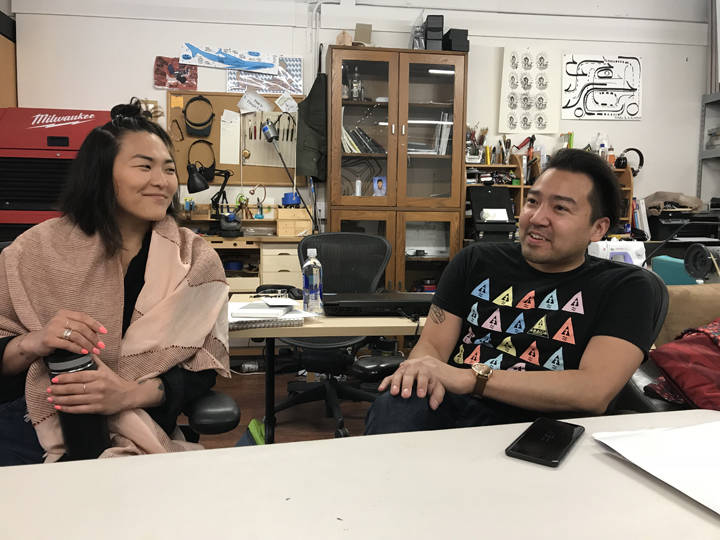 Local artists Christy Namee Eriksen and Rico Worl discuss their downtown art designs inside their studio downtown Tuesday. (Gregory Philson | Juneau Empire)