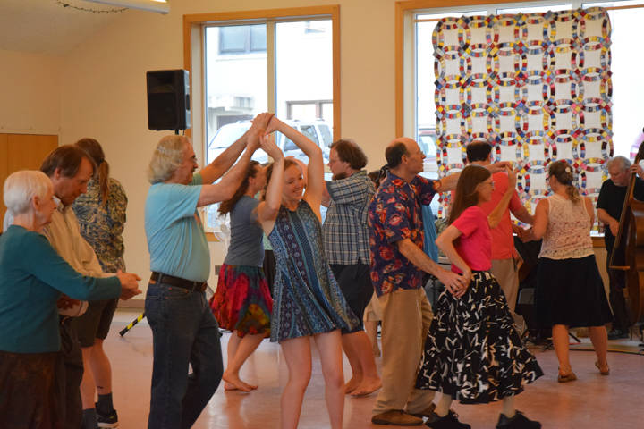 A group dances during the Barn Dance at St. Anns Parish Hall Tuesday, July 3. (Gregory Philson | Juneau Empire)