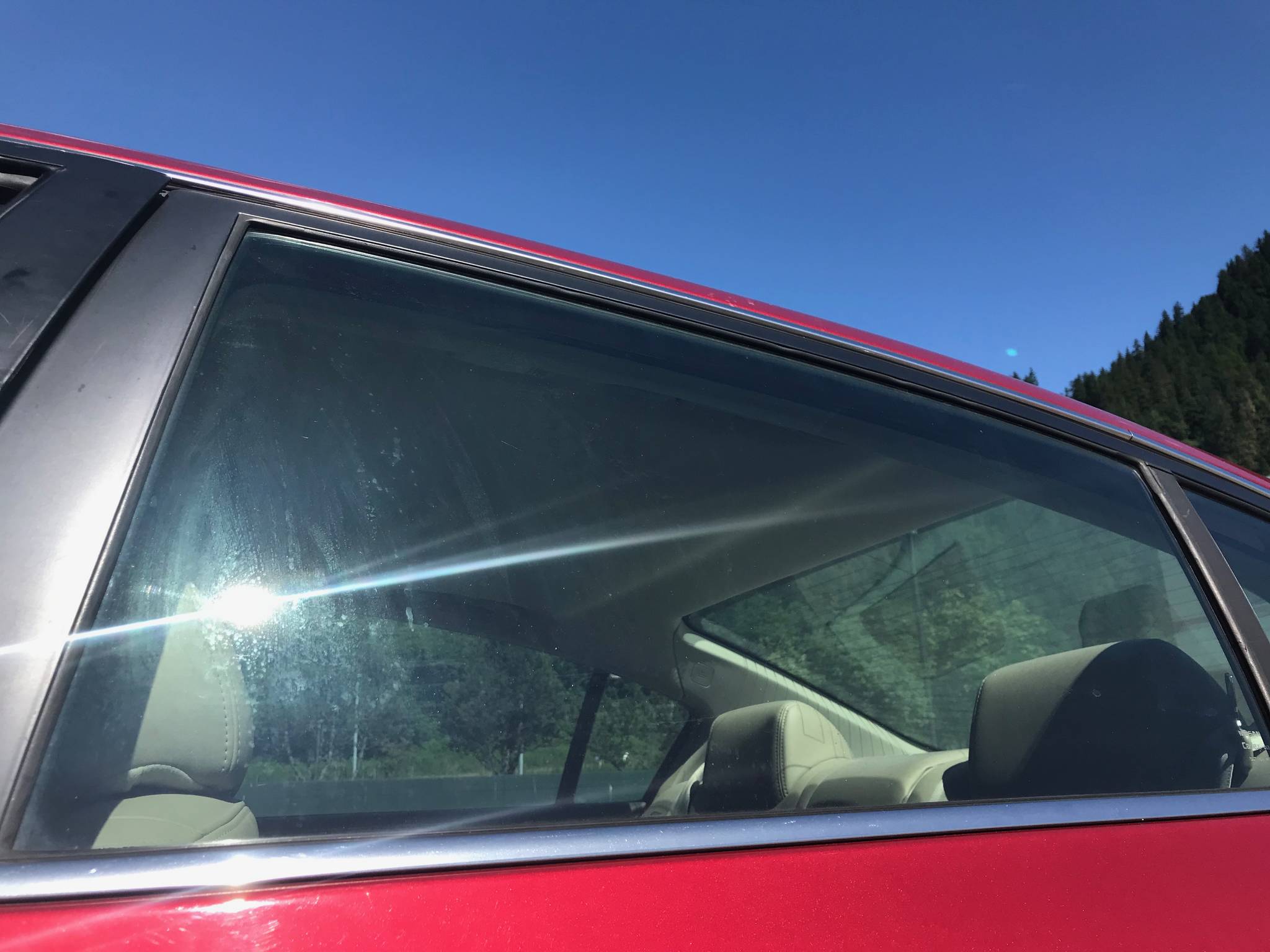 A car window is pictured July 4, 2018. This is not the car in which a dog died of heat stroke Tuesday. (Alex McCarthy | Juneau Empire)