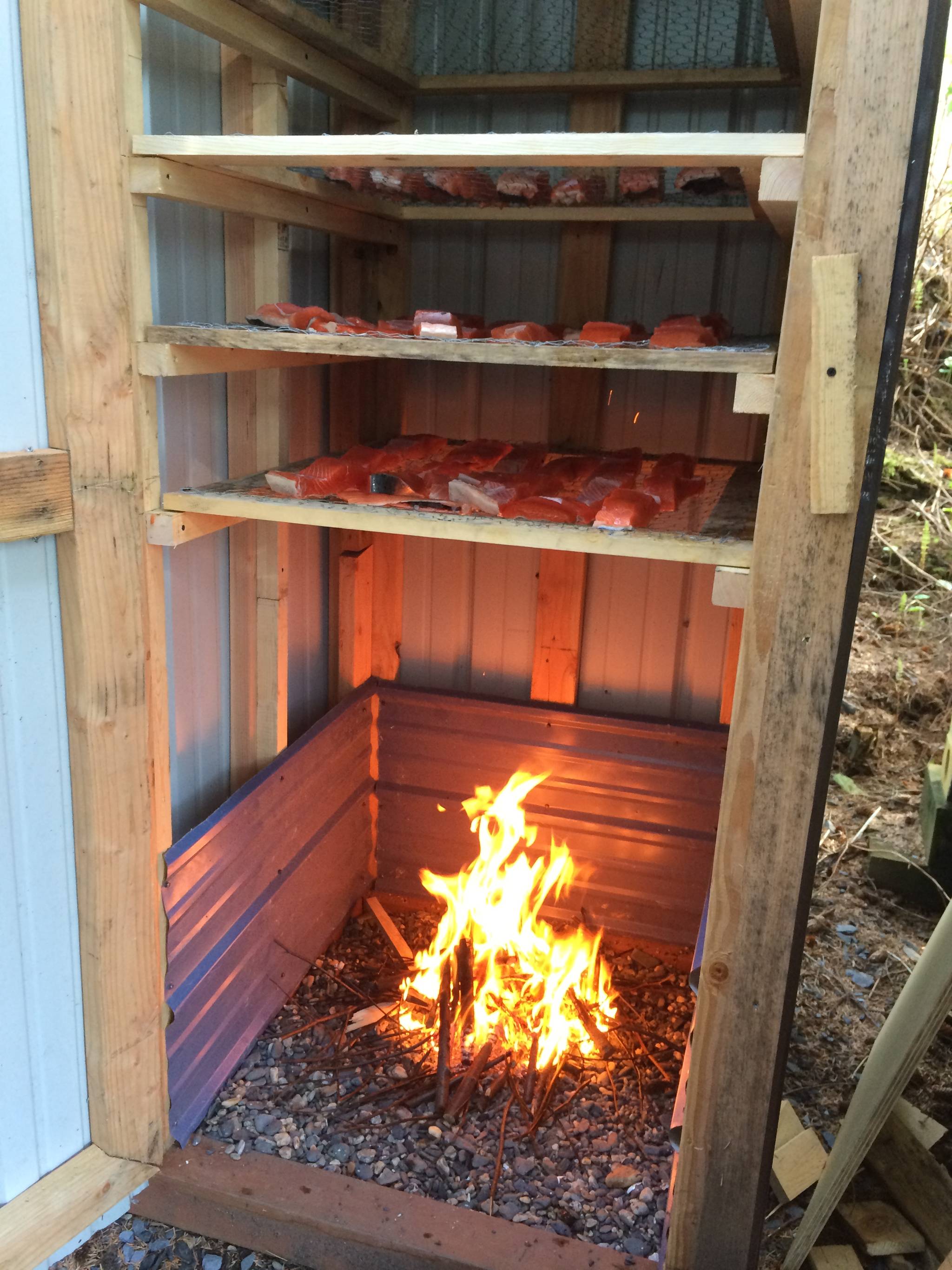 Starting the fire inside the smokehouse. Vivian Faith Prescott | For the Capital City Weekly