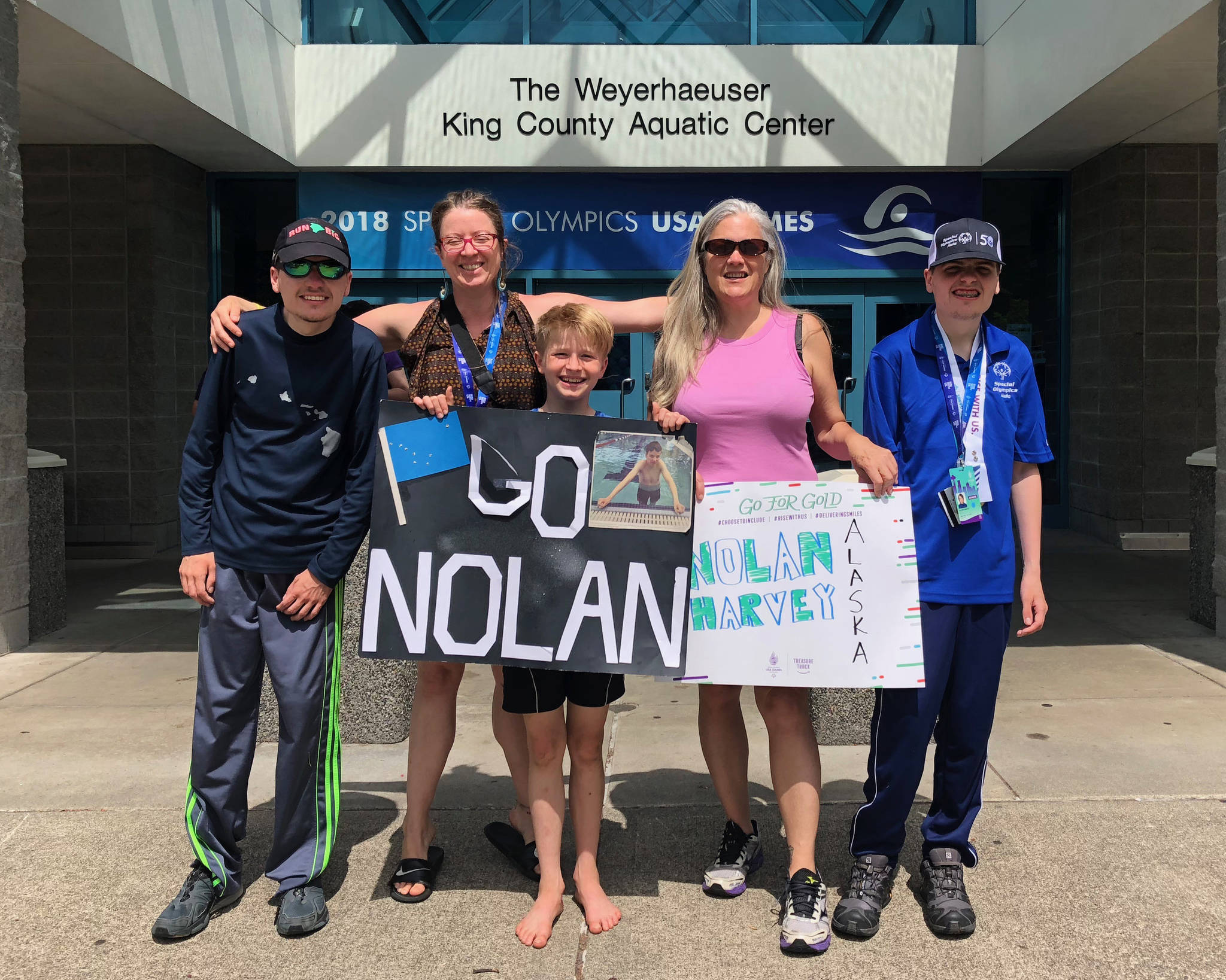 Nolan Harvey, far right, with (left to right) brother Ryan Harvey, friend Annie Geselle, friend Mattice Geselle and mom CJ Johnson outside the King County Aquatic Center, the site of the swimming events for the Special Olympics USA Games. (Courtesy Photo | CJ Johnson)