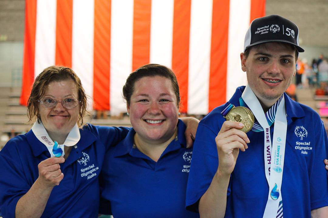 Nolan Harvey, right, shows off his gold medal with coach Tayvia Ruvane, center, and teammate Erica Pletting. (Courtesy Photo | Special Olympics Alaska)