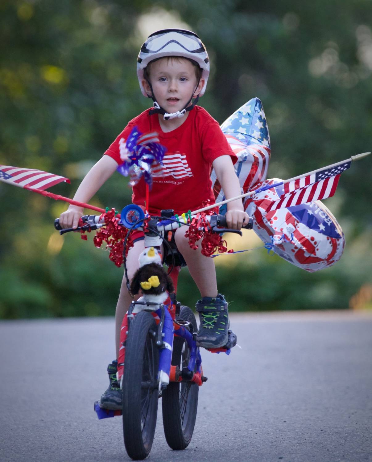 Alex Weiss is pictured riding his bike Wednesday, July 4, 2018. The Weiss family believes the bike, which won first place in the boys’ division of the Most Decorated Bicycle competition, was stolen after the annual Fourth of July parade in Douglas. (Derek Weiss | Courtesy Photo)