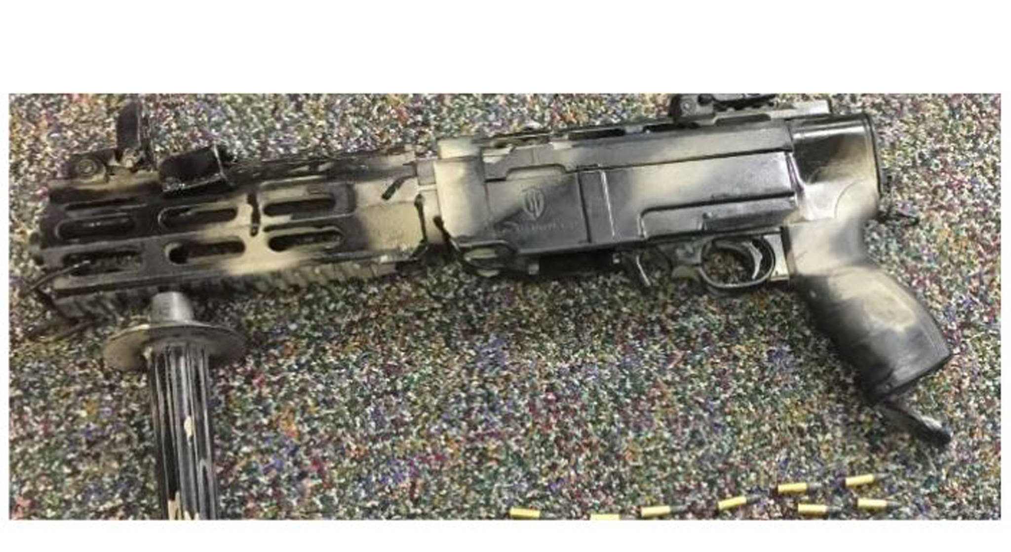 A 10/22 Ruger pistol is displayed with ammunition. This photo appears in the United States’ sentencing memorandum against defendant Christopher Davison. (U.S. District Court | Courtesy Photo)