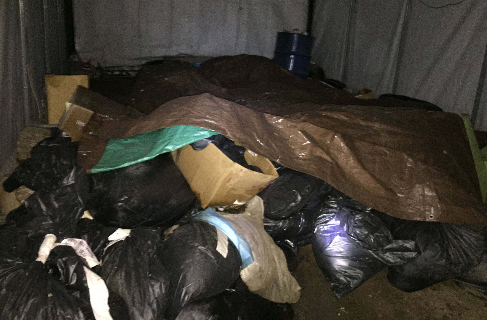 This photo, taken by a neighbor on Cohen Drive, shows the inside of a carport that was used to store dead animals prior to cremation. (Courtesy photo)
