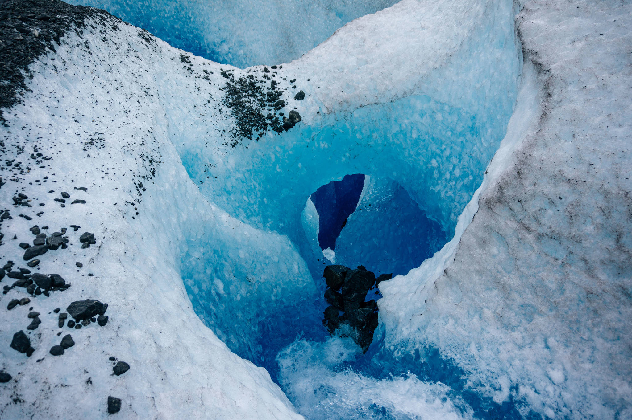 Stream carves glacier ice into tunnels, twists and turns. (Gabe Donohoe)