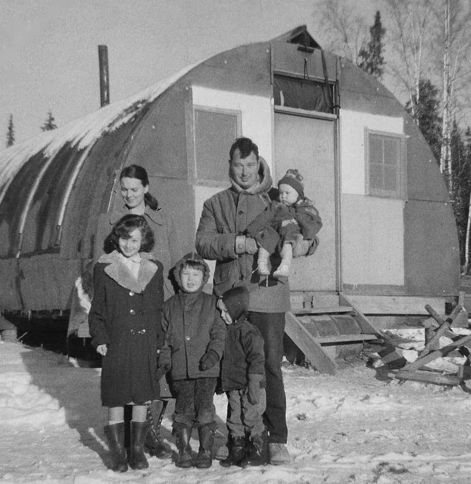 Living in the quonset hut on the homestead. Judy is being held by her father, Bob Longwith, and her mother Frances Longwith stands beside. Her older siblings stand in front. (Courtesy Photo | Judy Miller)