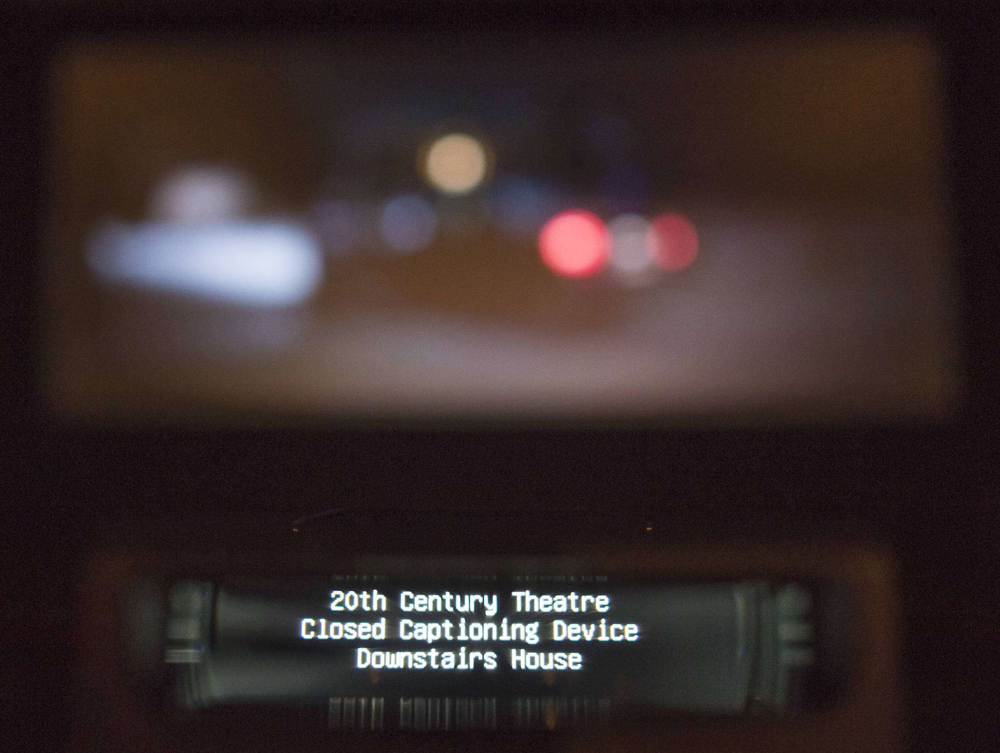A new closed captioning is demonstrated at the 20th Century Theatre in downtown Juneau on Monday, July 16, 2018. Both closed captioning and assistive listening systems are available both downtown and their Glacier Cinemas in the Mendenhall Valley. (Michael Penn | Juneau Empire)