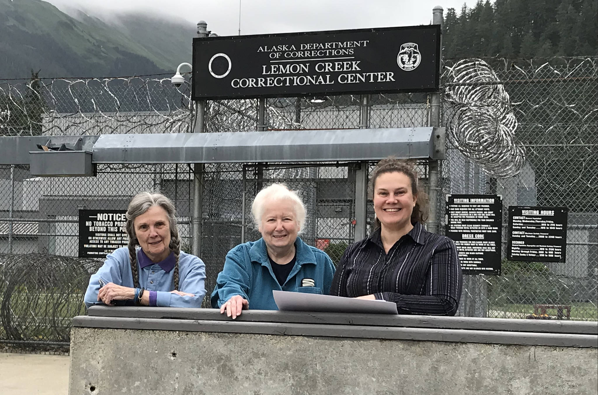 In this photo provided by the Alaska Division of Elections, Carolyn Brown (left) and Judy Andree of the Juneau Chapter of the League of Women Voters visit Lemon Creek Correctional Center on July 10, 2018 with Charity Coleman of the division. The division and league have begun a pilot program to allow eligible Alaska inmates to register to vote and seek absentee ballots. (Samantha Miller | Courtesy Photo)