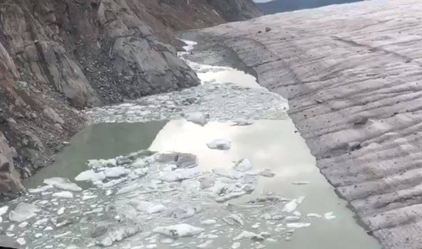 In this screenshot from a video shared Monday by Capital City Fire/Rescue, the waters of Suicide Basin have topped the low point in the dam holding the reservoir and are beginning to flow downhill. (Screenshot)