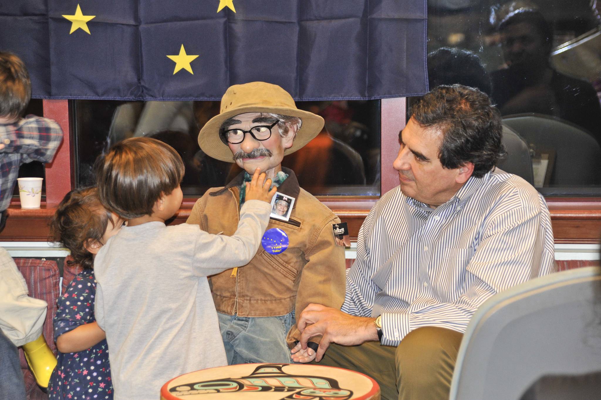 Children meet Chilkat Charlie at the Juneau Public Library during the childrens hour in November 2012. Carlton Smith is right by Charlie. Photo by Peter Metcalfe.