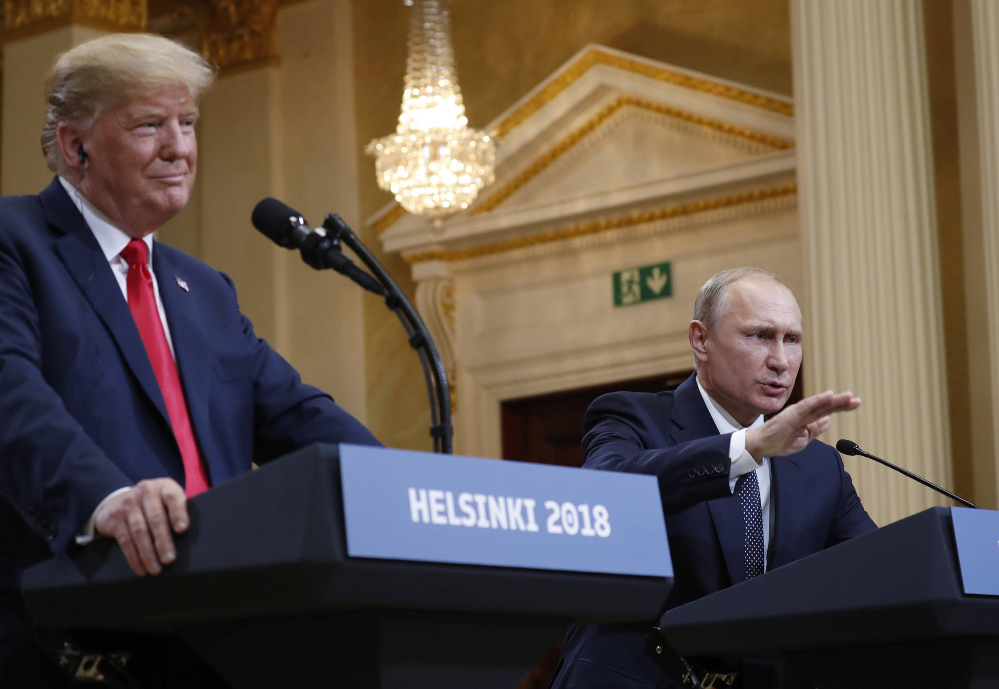 U.S. President Donald Trump, left, listens to Russian President Vladimir Putin during a press conference after their meeting at the Presidential Palace in Helsinki, Finland, Monday, July 16, 2018. (AP Photo/Pablo Martinez Monsivais)
