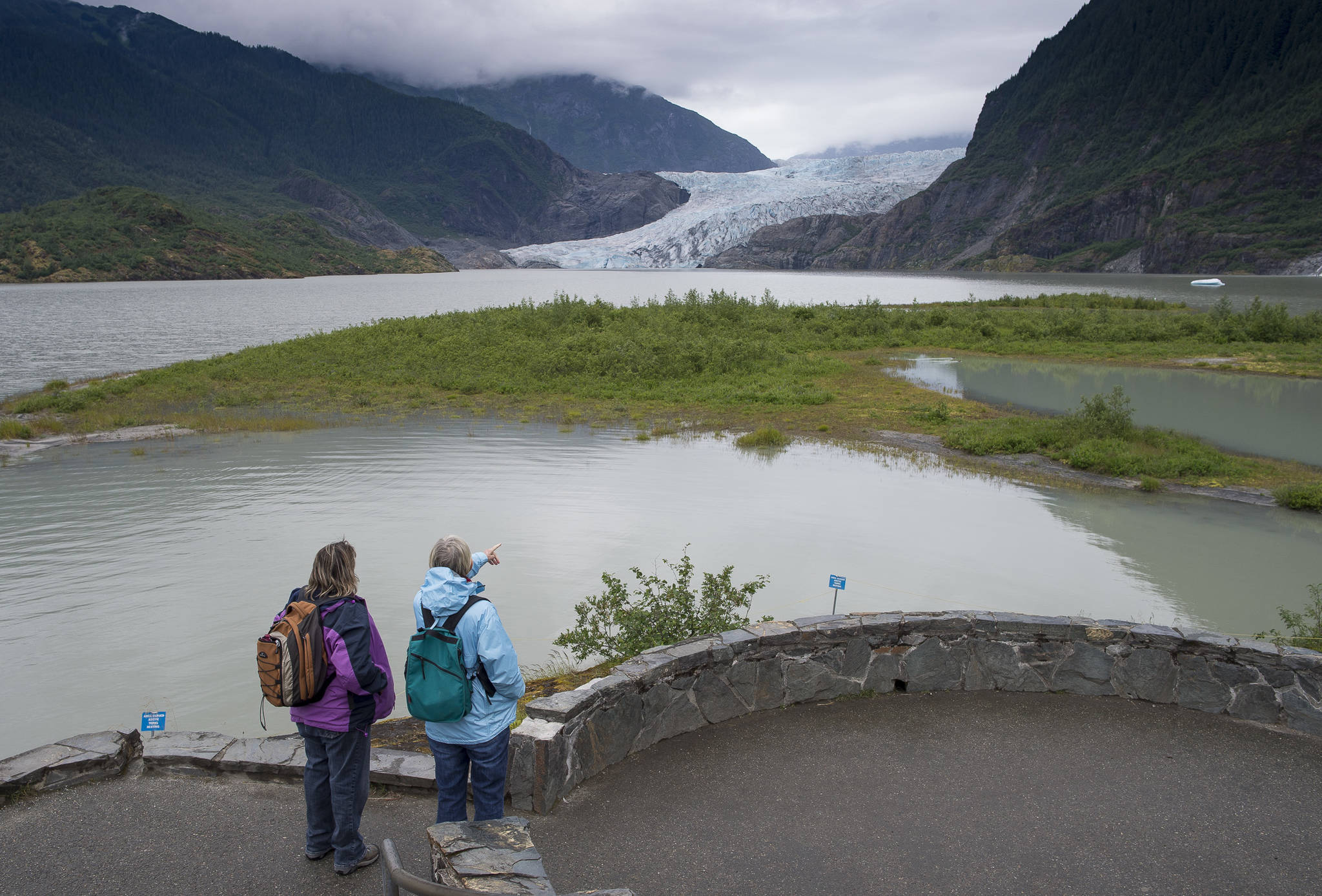 The Mendenhall Glacier as viewed from the Mendenhall Glacier Visitor Center on Wednesday, July 18, 2018. The National Weather Service has issued a flood watch saying Suicide Basin is now draining into Mendenhall Lake with potential flooding to begin by late Thursday afternoon. (Michael Penn | Juneau Empire)