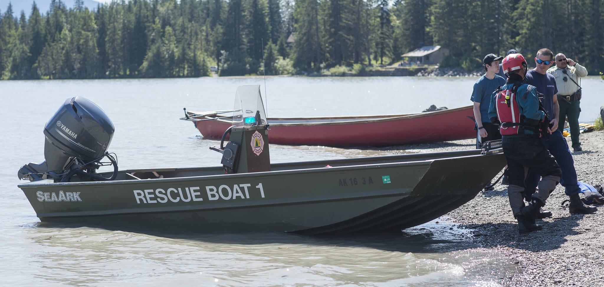 Capital City Fire/Rescue personnel respond to a overturned canoe at Mendenhall Lake on Friday, July 20, 2018. (Michael Penn | Juneau Empire)