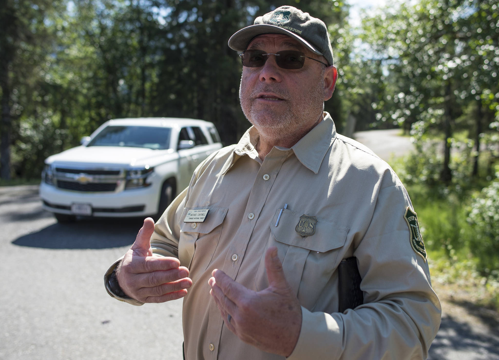 Ranger Michael Cantwell talks about the reopening of the Mendenhall Campground on Friday, July 20, 2018, after Thursday’s flood of Mendenhall Lake. (Michael Penn | Juneau Empire)
