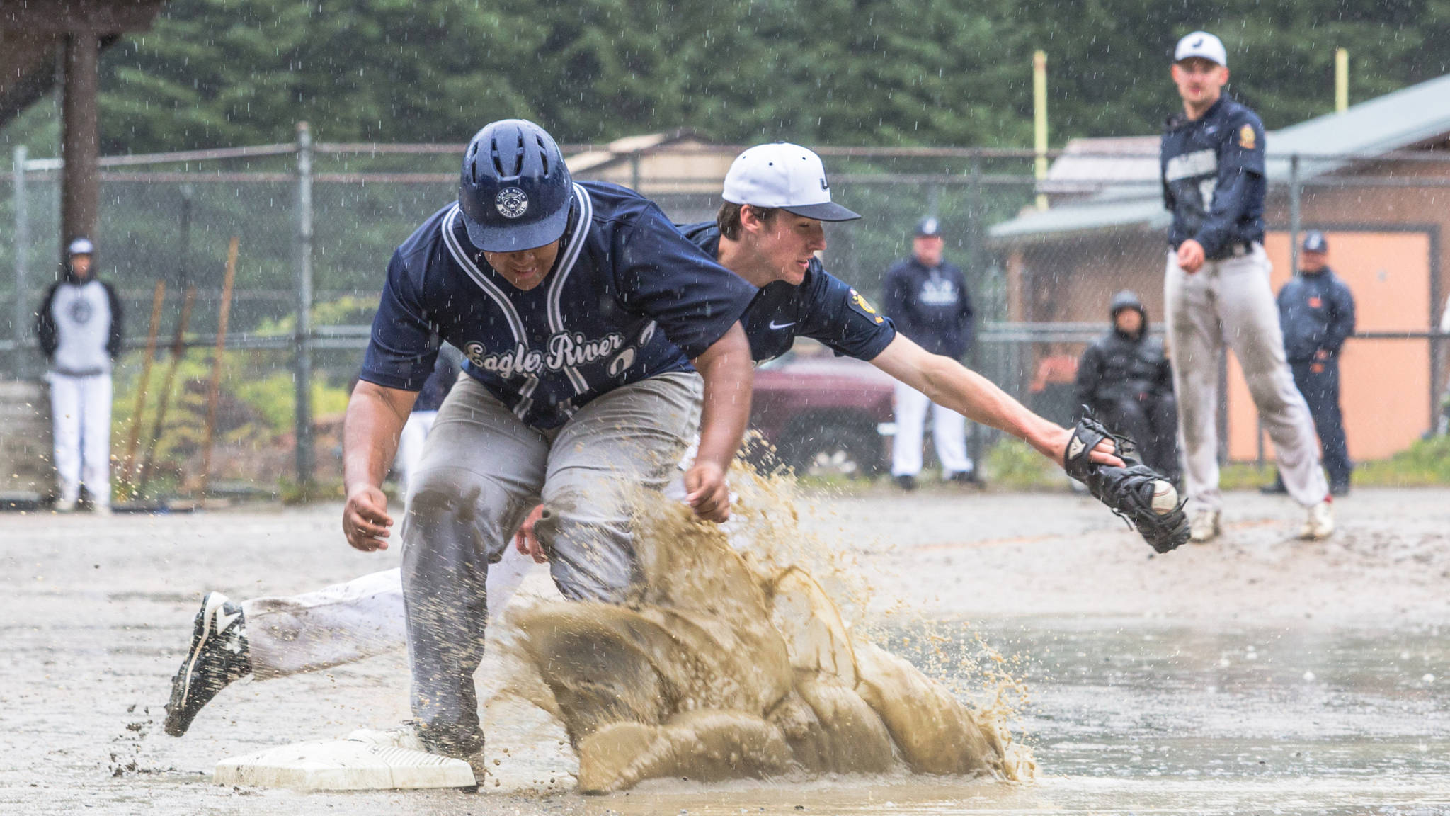 Juneau Post 25 first baseman Olin Rawson and Eagle River’s Orazio Ramos in Juneau’s final home game of the season on Sunday, July 15, 2018, at Adair-Kennedy Memorial Park. (Courtesy Photo | Heather Holt)