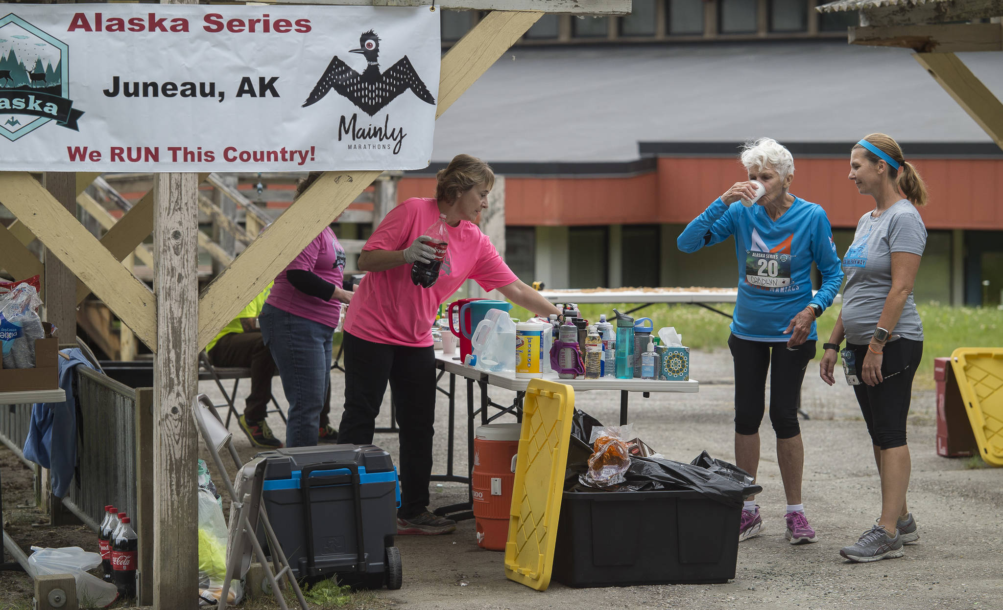 Carolyn Mitchell and her daughter, Connie Deverill, stop to drink and eat something during a marathon coordinated by Mainly Marathons at Mendenhall River Community School on Thursday, July 26, 2018. For Mitchell, 81, it was her 175th marathon. (Michael Penn | Juneau Empire)