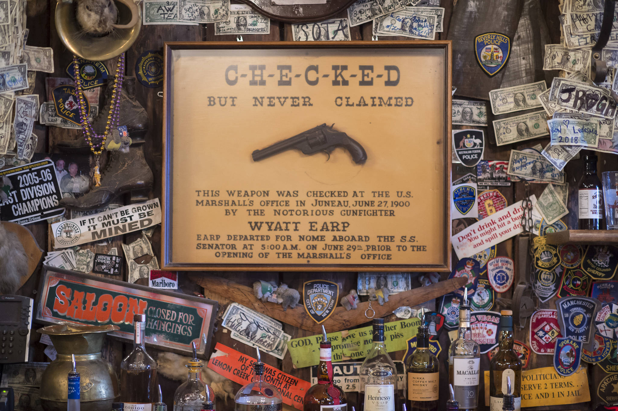 A framed gun said to have belonged to Wyatt Earp hangs at the Red Dog Saloon on Friday, July 27, 2018. (Michael Penn | Juneau Empire)