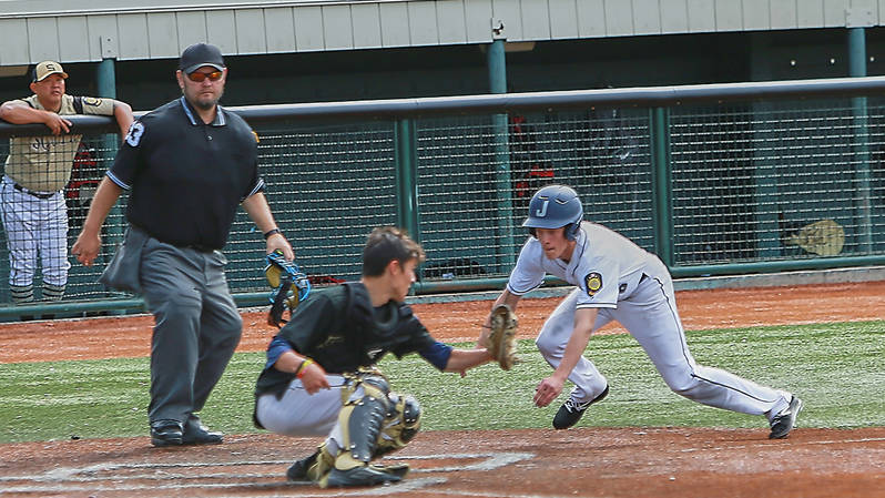 Juneau Post 25 shortstop Zeb Storie slides into home plate against South Post 4 in the American Legion state tournament at Mulcahy Stadium in Anchorage on Saturday. Juneau won 6-3. (Courtesy Photo | Jeremy Ludeman)