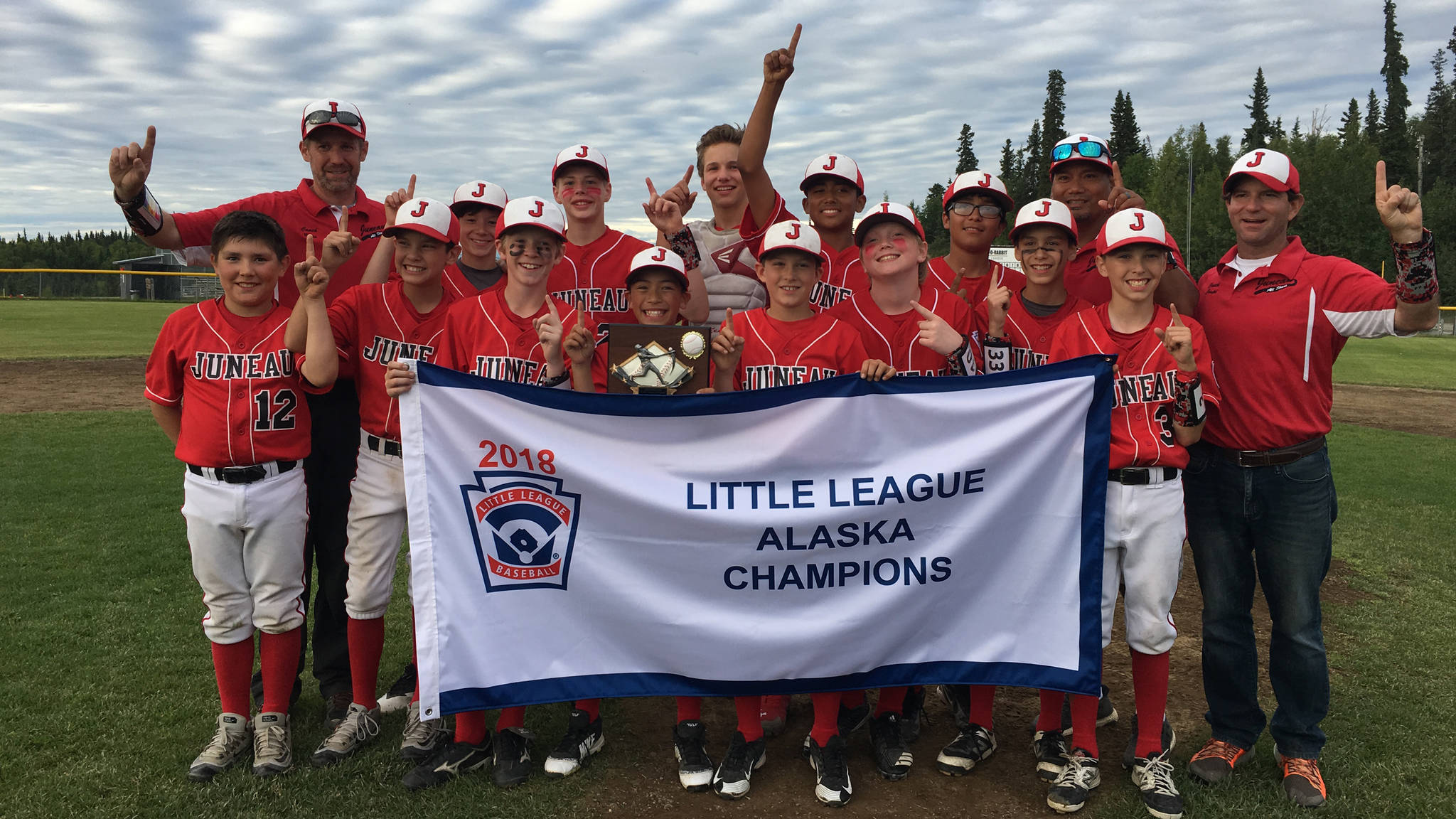 The Gastineau Channel Little League Major All-Stars pose with their state championship banner after defeating Abbott-O-Rabbit Little League, 5-3, on Monday evening at the Abbott-O-Rabbit Field Complex in Anchorage. (Courtesy Photo | David Buss)
