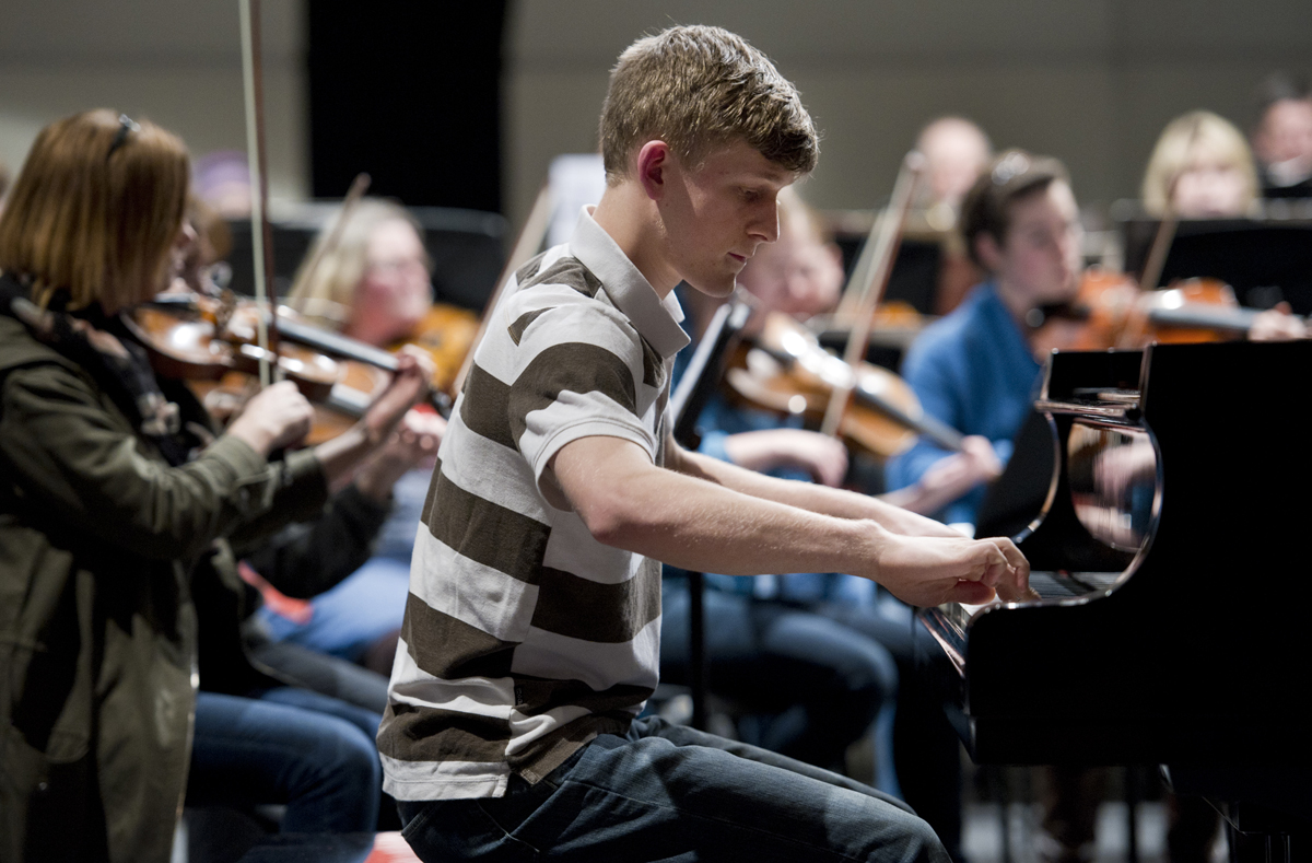Trevar Fiscus, winner of last year's Youth Solo Competition, practices a Shostakovich concerto with the Juneau Symphony at Thunder Mountain High School on Tuesday.