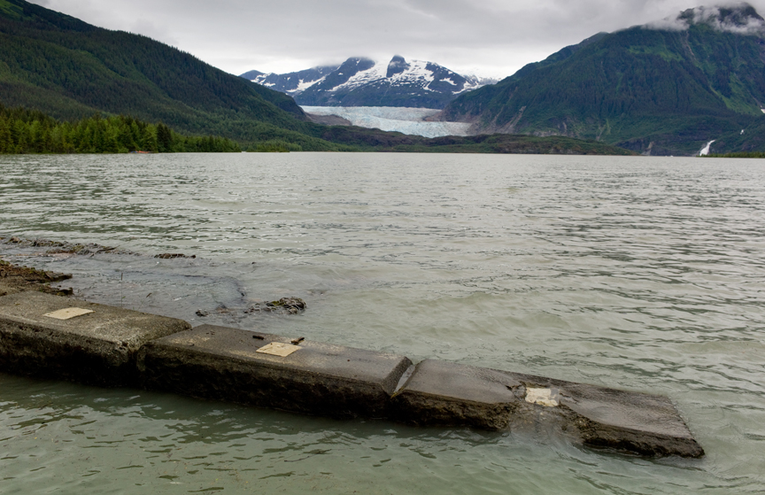 In this July 2014 file photo, rising water starts to cover the Skater's Cabin walkway to Mendenhall Lake after reports that the ice lake in Suicide Basin has released.