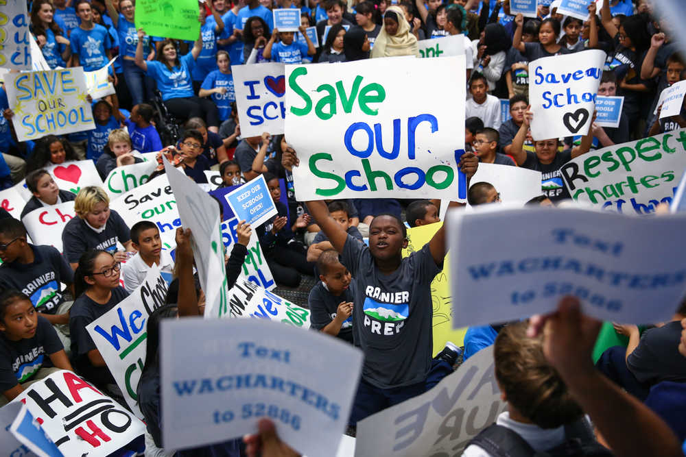 Hundreds of students rally Thursday, September 10, 2015, at Summit Sierra public charter school in Seattle's International District. Charter school students, parents and staff rallied to support the schools and to call for Governor Jay Inlsee and the legislature to show their support after the State Supreme Court ruled state funding of the schools to be unconstitutional. (AP Photo/seattlepi.com, Joshua Trujillo)