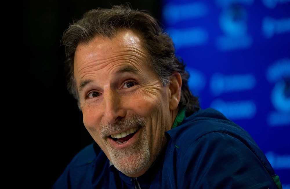 FILE - In this April 14, 2014 file photo, Vancouver Canucks' head coach John Tortorella laughs after a reporter mistakenly called him Mike during an end of season news conference in Vancouver, British Columbia.   A person familiar with the decision has confirmed to The Associated Press that  Tortorella has been selected to head the United States national team competing in the World Cup of Hockey tournament next year. The person spoke on the condition of anonymity because USA Hockey is scheduled to make a formal announcement late Monday, Sept. 21, 2015.  Canada's TSN sports network first reported the news earlier in the day.  (AP Photo/The Canadian Press, Darryl Dyck)