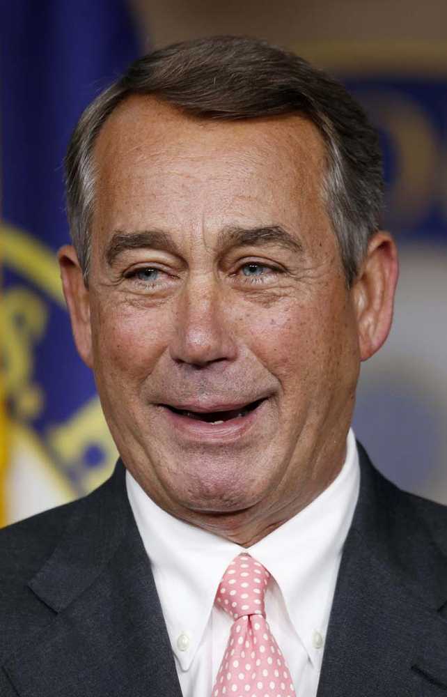 House Speaker John Boehner of Ohio smiles during a news conference Friday on Capitol Hill in Washington where he announced that he would resign from Congress at the end of October.