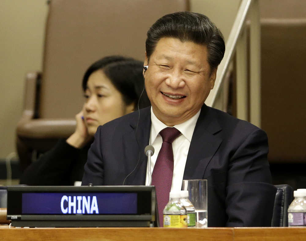 Chinese President Xi Jinping laughs during a meeting on gender equality and women's empowerment Sunday at United Nations headquarters.