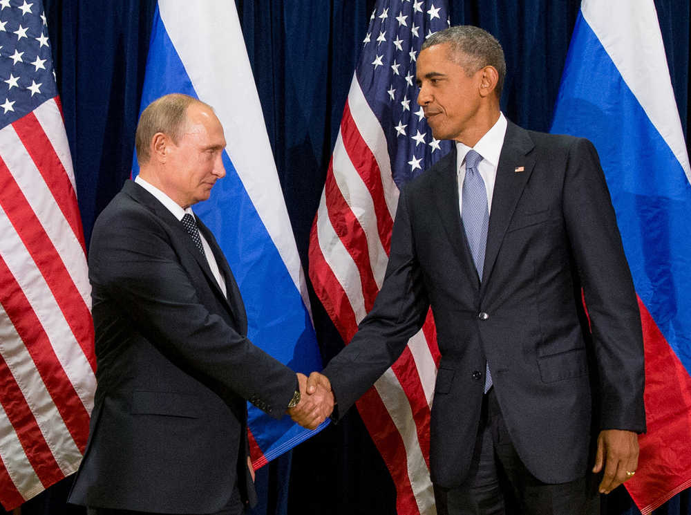 United States President Barack Obama, right, and Russia's President President Vladimir Putin pose for members of the media before a bilateral meeting Monday, Sept. 28, 2015, at United Nations headquarters. (AP Photo/Andrew Harnik)