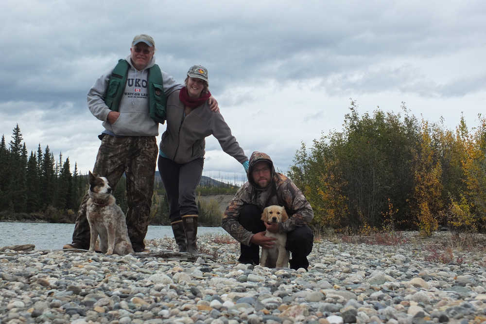From left to right, Loki, Nils Dihle, Mary Catharine Martin, Bjorn Dihle and Fen pause for a photo shortly after shooting some rapids on the Big Salmon River.