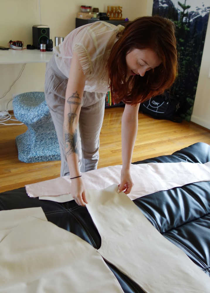 Shea Wilcox lays out unfinished pieces for the collection she will show at Portland Fashion Week at her Portland apartment in September.