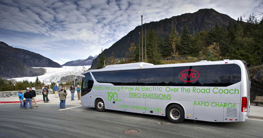 An electric motor coach provided by BYD Auto Co., Ltd., a Chinese automobile manufacturer based in Shenzhen, Guangdong Province, and Alaska Coach Tours stops at the Mendenhall Glacier Visitor Center to showcase the potential for electric vehicle bus transportation as part of the tourism industry in Alaska on Tuesday.