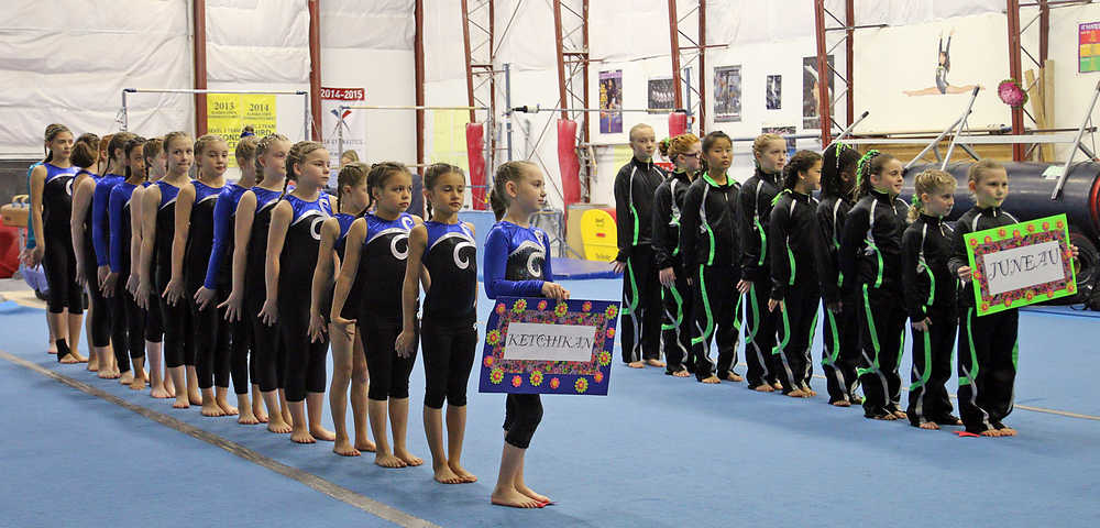 The girls level 2-3 gymnasts from Ketchikan and Juneau march in to open the Saturday competition.
