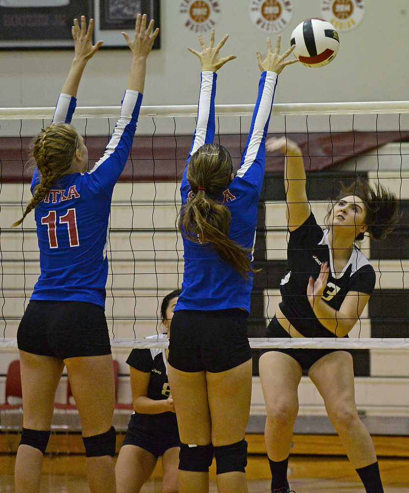 Petersburg's Kyla Willis (13) kills a shot against Sitka during the Juneau Invitational Volleyball Extravaganza (JIVE) at JDHS.