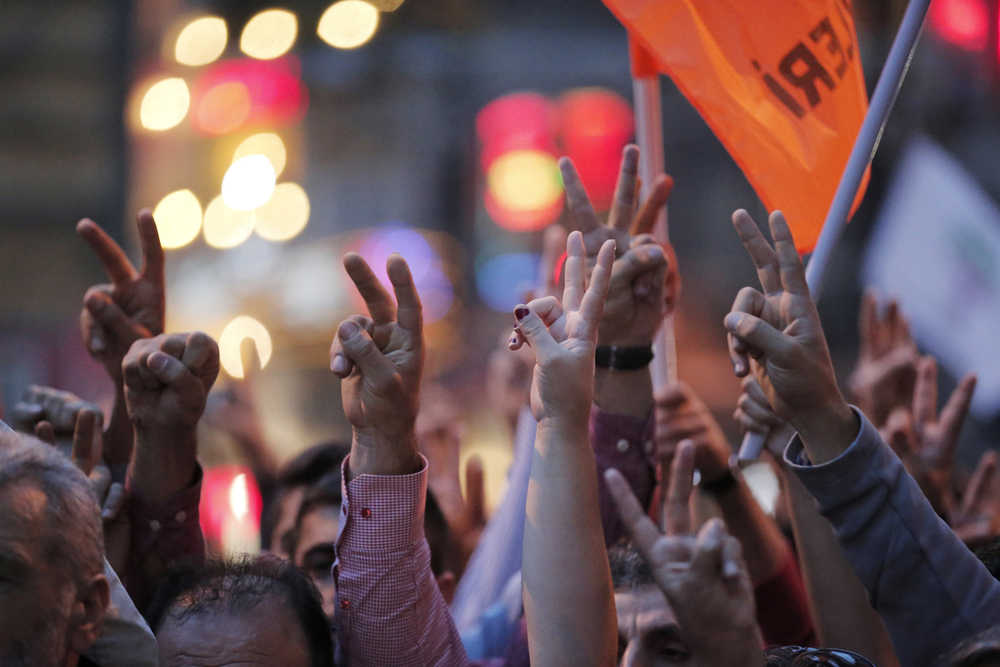 Demonstrators flash the V-sign during a rally in central Istanbul to protest the bombing in Ankara earlier Saturday. Thousands of protestors flooded the main street in central Istanbul shouting slogans condemning the twin bombings that killed dozens of people in nation¹s capital. The two bomb explosions targeted a peace rally, that was aimed to call for an end to the renewed violence between Kurdish rebels and Turkish security forces.