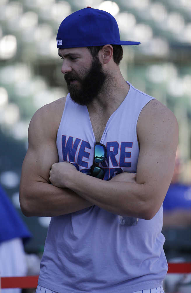 Chicago Cubs pitcher Jake Arrieta attends an NLDS baseball practice on Sunday, Oct. 11, 2015, in Chicago. The Cubs are to face the St. Louis Cardinals in Game 3 of the National League Division Series on Monday. (AP Photo/Nam Y. Huh)