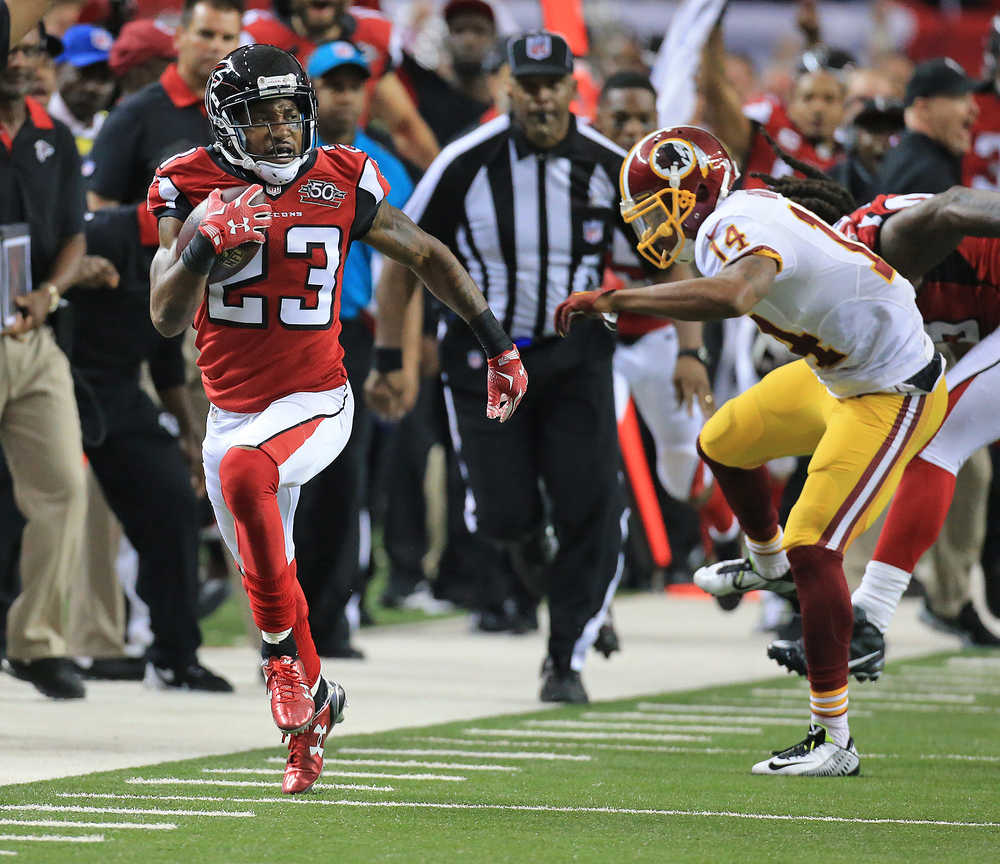 RETRANSMISSION TO CORRECT DAY TO SUNDAY - Atlanta Falcons cornerback Robert Alford intercepts Washington Redskins quarterback Kirk Cousins during overtime and returns the ball for the game winning touchdown in an NFL football game, Sunday, Oct. 11, 2015 in Atlanta. (Curtis Compton/Atlanta Journal-Constitution via AP) MARIETTA DAILY OUT; GWINNETT DAILY POST OUT; LOCAL TELEVISION OUT; WXIA-TV OUT; WGCL-TV OUT; MANDATORY CREDIT
