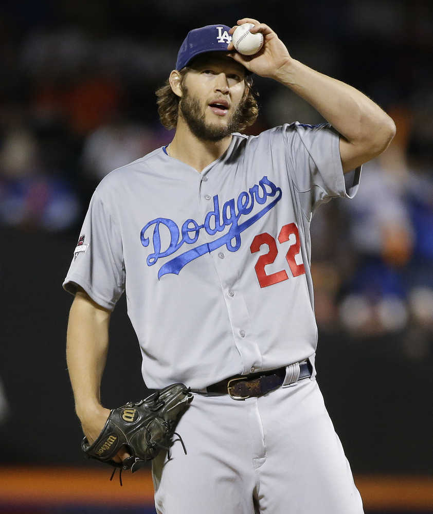 Los Angeles Dodgers pitcher Clayton Kershaw (22) adjusts his cap between pitches against the New York Mets during the first inning of baseball's Game 4 of the National League Division Series, Tuesday, Oct. 13, 2015, in New York. (AP Photo/Frank Franklin II)